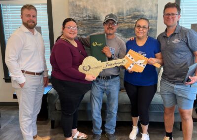 Alexander Jensen with clients after closing real estate deal